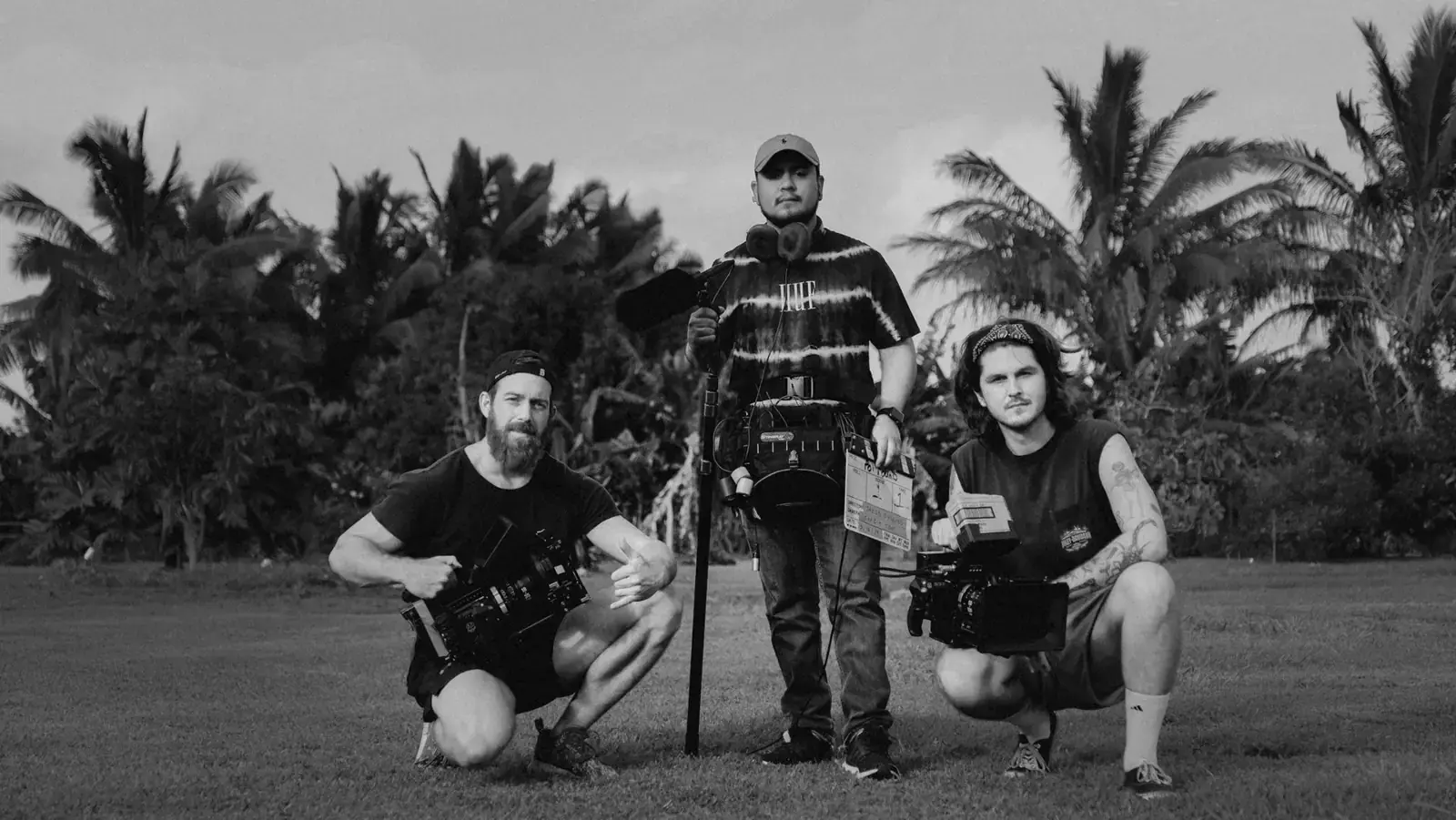 Film crew posing with camera gear.
